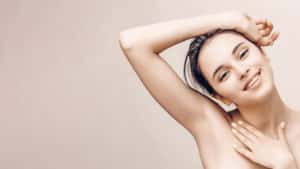 Natural beauty portrait of female face and body with perfect skin. Deodorant advertising and hair epilation concept.