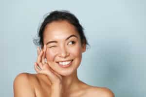 Woman smiling after brow lift in Dallas, TX