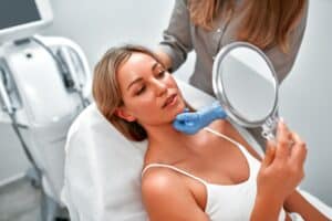 Woman meeting with plastic surgeon for brow lift consultation in Dallas, TX